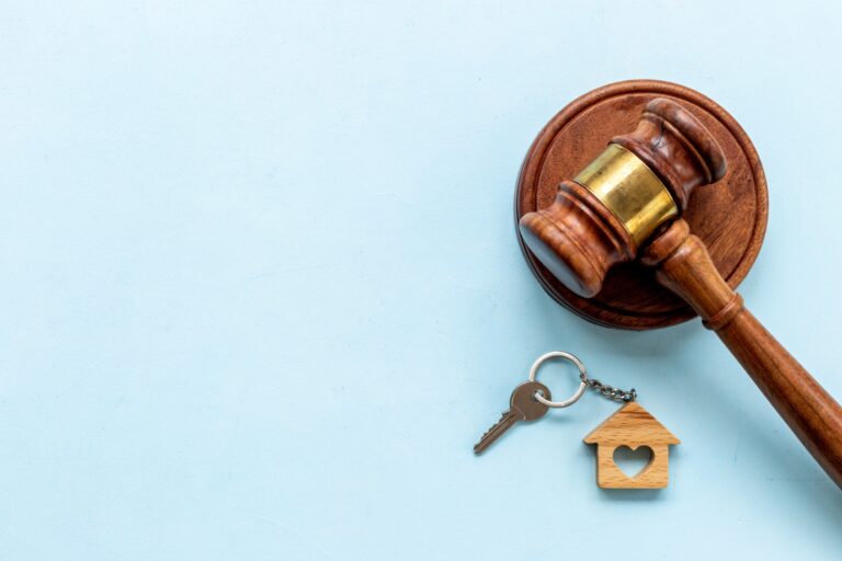 House shaped keychain and keys with judges gavel.